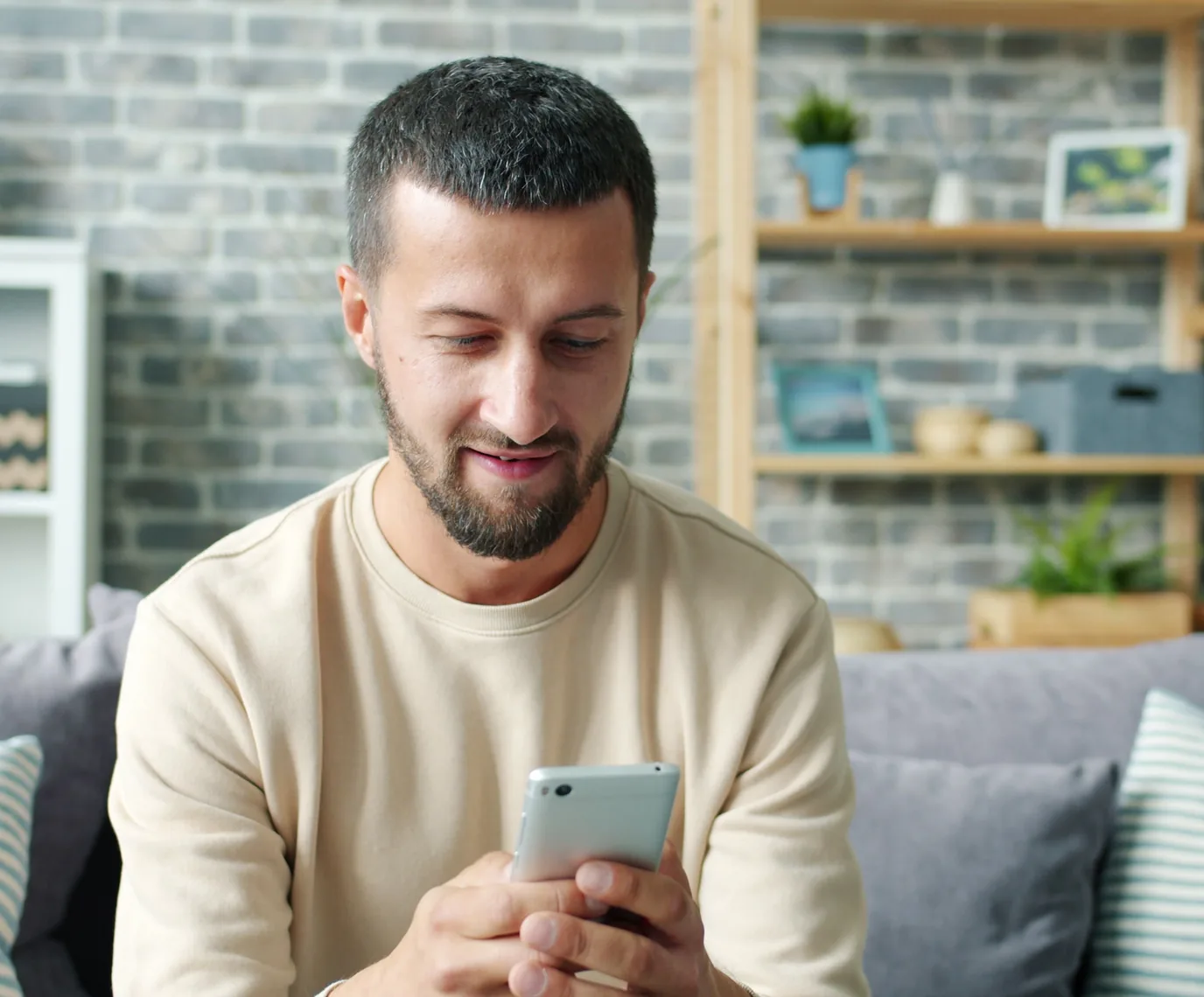 Man using a smartphone to join the heart scan waitlist